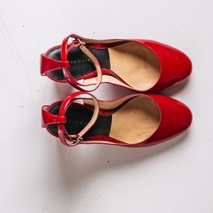 Ankle strap heels with adjustable buckle.